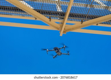 drone under a bridge doing an inspection