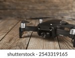 Drone unmanned aircraft on textured background. Modern FPV drone on background. The drone quadcopter. aircraft on the radio control. Drone for racing, filming and entertainment.