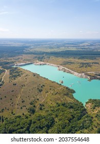 Drone View Of The Chalk Quarries On A Sunny Summer Day Near Krichev, Belarus. Open-pit Mining. Beautiful, Fascinating Landscape With Turquoise Water. Vertical Photo