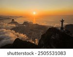 Drone view of Christ the Redeemer during the sunrise over Guanamara Bay in Rio de Janeiro