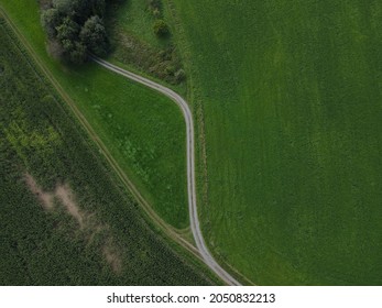 Drone View Of Curved Gravel Road In The Landscape