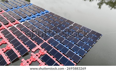 Drone view of Floating Solar Panel. Solar photovoltaic panel PV System in Industry lake water pond. Saving Energy with Clean Power.