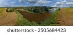 Drone view of the forest and fields, top view and blue sky on a sunny summer day