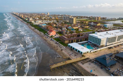 Drone View High Above The Beach Vacation Travel Destination Of South Padre Island , Texas , USA Long Pier And Many Condos And Buildings Across The Island