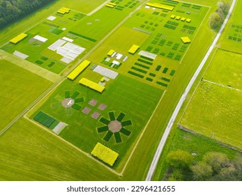 Drone view of a large experimental crop field showing the abstract shapes from the air. The crops are grouped to be tested in closed conditions. - Shutterstock ID 2296421655