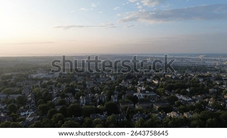 Drone view of low sunset small urban housing area - Wirral, Merseyside, Birkenhead, UK