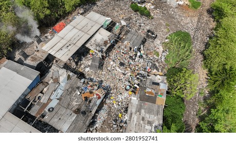 Drone View Of Massive Illegal Garbage Dump Surrounding Makeshift Shacks