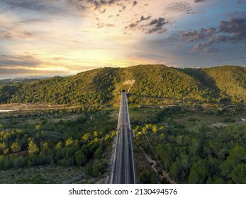 A Drone View Of A Modern Bridge With A Modern High-speed Railway Leaning To Tunnel In Spain