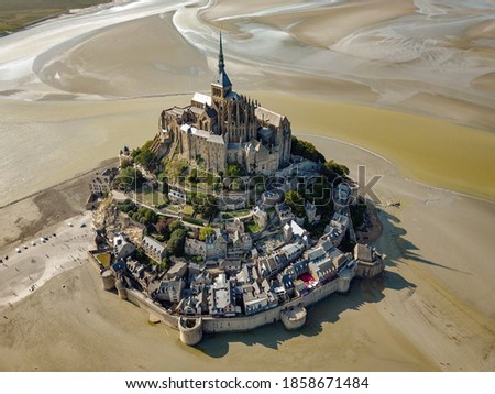 Drone view of the Mont Saint Michel castle in France surrounded by the sea
