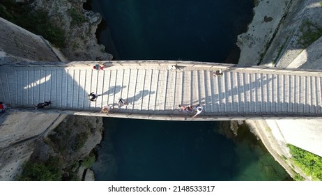 Drone view of Mostar Bridge in the Balkans, an example of ottoman architecture, old bridge view made of stone connecting the city of Mostar