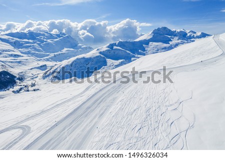 Drone view of mountain ski slopes.