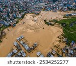 Drone view of the Nakhu River flooded and affected the riverbanks and homes during heavy rainfall in Lalitpur, Nepal, 