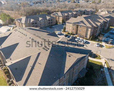 Drone View of New Apartments With Asphalt Shingles