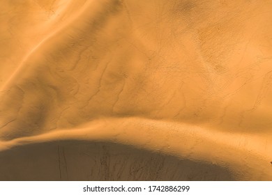Drone view on sand dunes of a desert, aerial photography of desert, sand trails