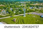 Drone view of Rastin Observation Tower with distant houses and neighborhood