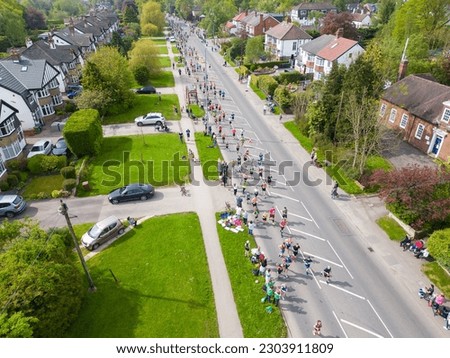 Drone view of runners competing in the Rob Burrow Leeds Marathon race and Half-Marathon running on Otley Road, Adel, at the 6 mile point.  Foto stock © 