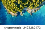 Drone view of the sea coast. Rocky shore and sea water. Vacation and travel. Summer seascape. aerial view. Image for cards, background, wallpaper or design.