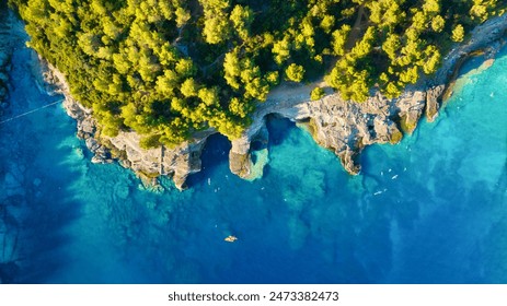 Drone view of the sea coast. Rocky shore and sea water. Vacation and travel. Summer seascape. aerial view. Image for cards, background, wallpaper or design. - Powered by Shutterstock