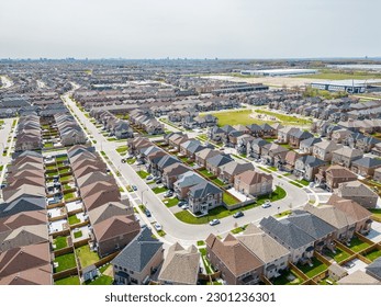 Drone view, sun-drenched Brampton real estate, lush green yards, picturesque houses off Bramalea-Mayfield. Summer in Ontario at its best."