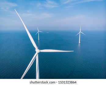 Drone View Of An Wind Mill Farm, Aerial View From The Sky At Windmill Park In Ocean At Sea By The Netherlands