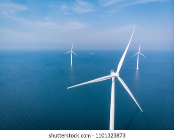 drone view of an wind mill farm, aerial view from the sky at windmill park in ocean at sea by the Netherlands