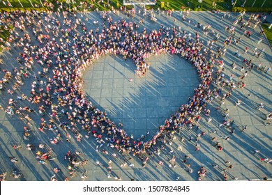 Drone view of women who formed a huge heart shape in the main square of Izmir. International Fancy Women Bike Ride Tour. 