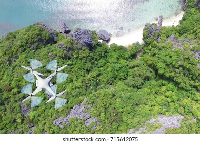 Drones camera flying in the sky with ocean lagoon views by the beach.