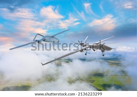 Drones in flight one after another perform surveillance over the territory