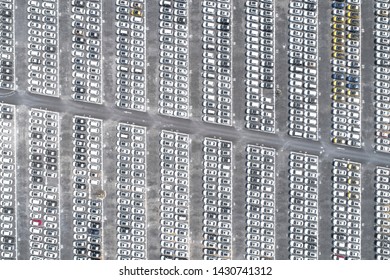 Drones overshoot large car parking lot densely arranged factory new car