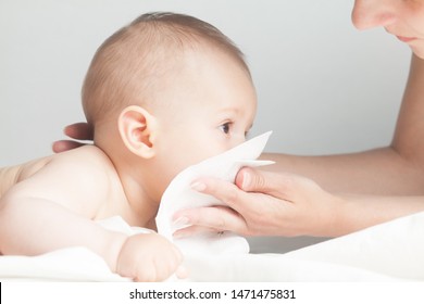 Drooling Sick Caucasian Infant Kid With Runny Nose,baby Blowing Nose,mom Wiping It With Tissue,healthcare Concept, Coronavirus SARS-CoV-2 COVID-19 Disease,home Quarantine Isolation,protect And Prevent