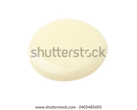 Drop of condensed milk isolated on white