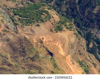 Drop down view of trail following volcanic mountain ridge.