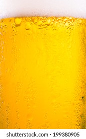 Drop And Foam Of Beer As Background