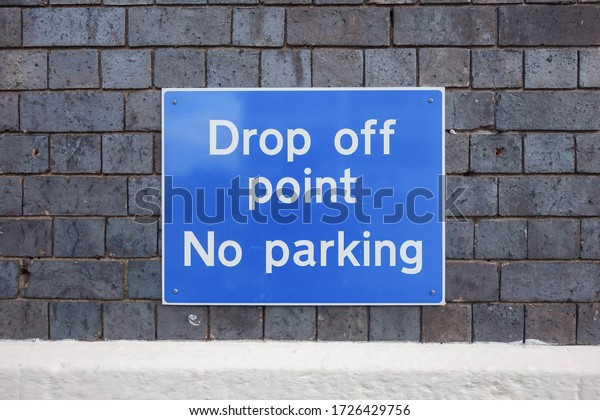 Drop off point - No parking\
sign