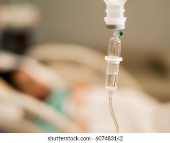 Drop Of Saline Solution,IV Drip Chamber, IV Tubing, And IV Bag Of Solution With Copyspace, Infusion Bottle With Saline Solution For Patient In Hospital Room