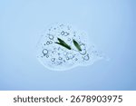 A drop of shampoo with bubbles. A texture with a leaf in it.