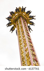 Drop Tower Ride At A Carnival, With Rider's Feet Showing.