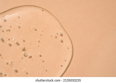 Drop of transparent cosmetic textured gel on beige background with bubbles. Copy space. Bath gel background - Shutterstock ID 2135033235