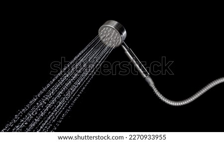 Drop of water coming out of a shower on the black background,Shower working water fly in the air