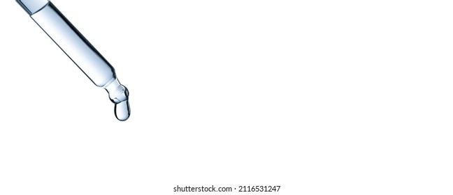 Drop of water falling from glass lab pipette isolated on white background. Macro. Blue tone - Powered by Shutterstock