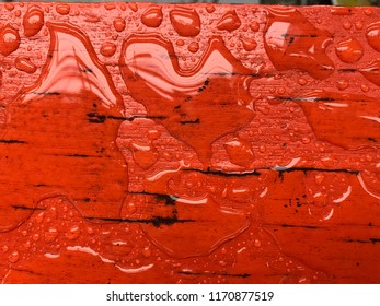  drop of water on wooden floor, red paint 