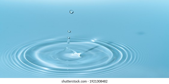 Drop of water drop to the surface. Waves on the surface of the water from a collision