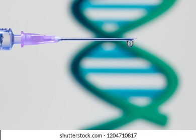 A droplet of vaccine at the tip of the needle and syringe reflecting a DNA structure - Powered by Shutterstock