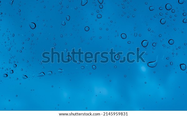 Droplet of water on\
car mirror, traffic\
jam\
