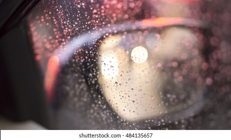 Droplets And Car Lights Reflections Through Foggy Car Window