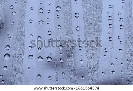 droplets of water on a cold glass in winter
