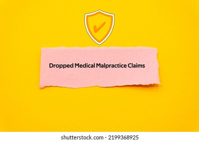 Dropped Medical Malpractice Claims.The Word Is Written On A Slip Of Colored Paper. Insurance Terms, Health Care Words, Life Insurance Terminology. Business Buzzwords.