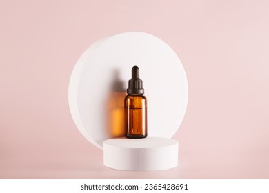 Dropper bottle mockup stands in front of white circle. - Shutterstock ID 2365428691