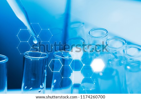 Dropping chemical liquid to test tube, laboratory research and development concept. scientist sample chemistry or medicine test