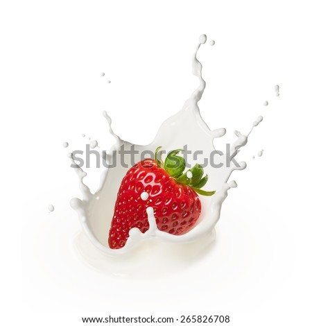 dropping a strawberry into milk causing splash